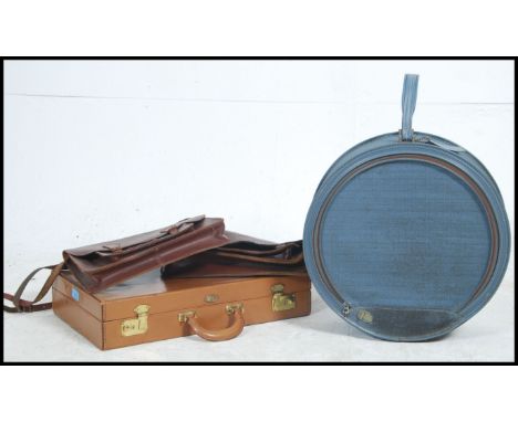 A  retro round Atlantic suitcase together with 2 vintage leather satchels and a leather attache case. Measures 10cm high x 49