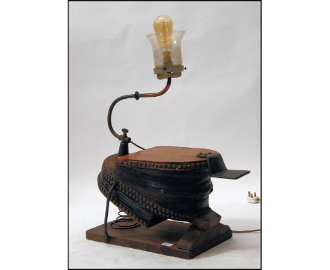 An upcycled 19th century bellows light - lamp. The oak and leather bellows with an upcycled vintage dairy lamp added to the t