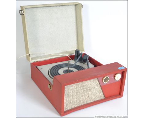 A vintage BSR record deck set in a red and cream vinyl case