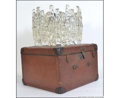 A retro 1960's faux glass resin set chandelier together with a vintage leather hat box bearing travel labels Measures 40cms w