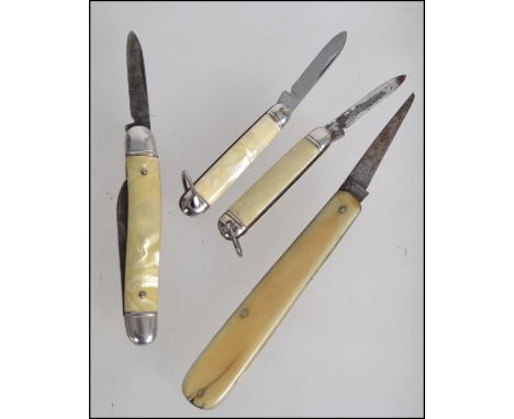 A collection of vintage petrol and gas lighters to include Ronson, Benlow and others along with three mother of pearl handled