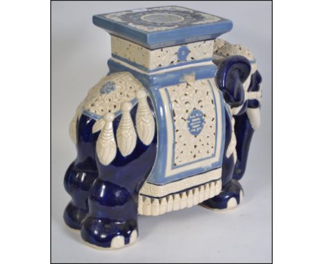 A large floor standing ceramic plant stand in the form of an Indian elephant H44cm