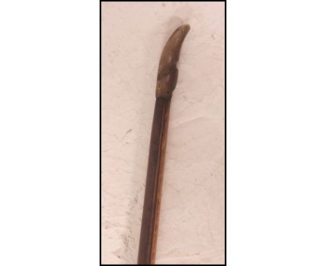 A 20th century sports Longbow - bow, with leather grip, constructed from yew and stamped for Earth Sports / Spotts ? W29cm