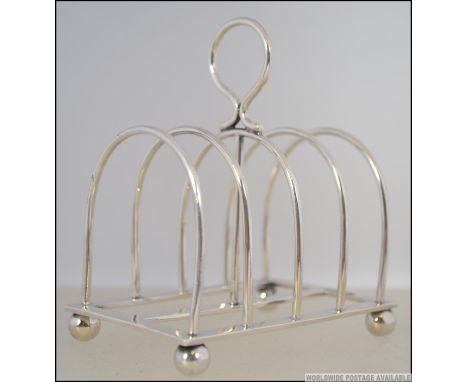 A silver hallmarked toast rack  by William Hutton & Sons Ltd, Sheffield 1903. Weight 83.1g. Measures 11cm high.