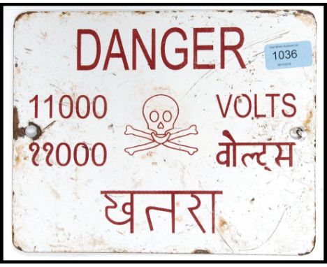 A vintage enamel 20th century sign Danger 11000 Volts. Sign in both English and Hindi. Measures 25cm x 20cm