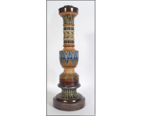 An early 20th century large Doulton Lambeth stoneware candlestick of geometric design with single sconce. Measures 40cm high.