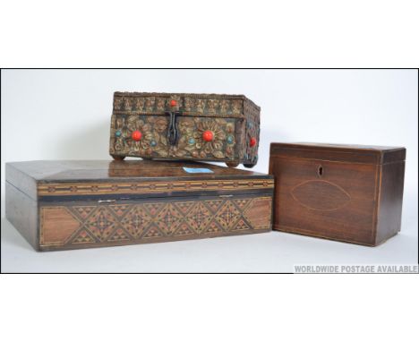 A tunbridge inlaid workbox of sarcophagus form together with a Georgian inlaid single tea caddy along with another being ston