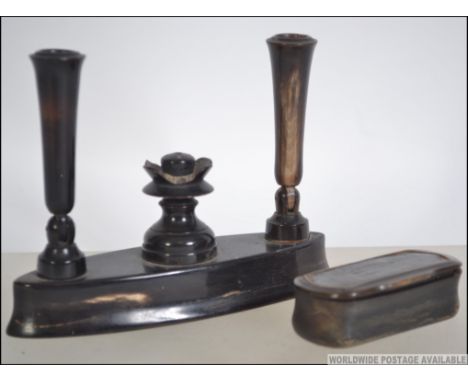 A  19th century gentlemans snuff box made from horn together with a horn 19th century pen holder. Measures 11cm high.