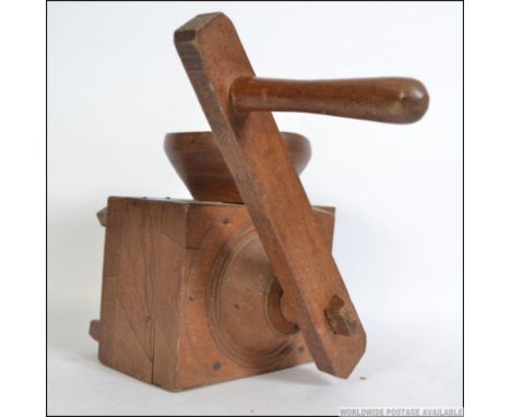 An early 20th century  beechwood French farmhouse buckwheat meal grinder of large form . Complete with handle having affixed 