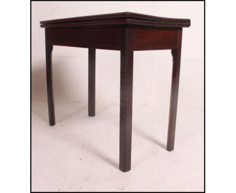 A Georgian 19th century solid mahogany tea table raised on squared legs with flip over table being raised on gate leg action.