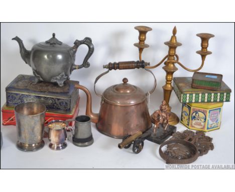 A dealers lot to include tins, copper kettle, Victorian pewter kettle, candelabra, cannon, statue, pewter tankards etc
