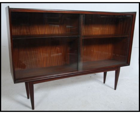 A large stunning Danish inspired vintage / retro mid 20th century teak bookcase having sliding glass doors with adjustable in