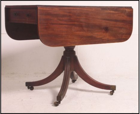 A 19th century Georgian mahogany inlaid sofa table raised on a quadruped base with column to centre. Atop a single drawer fri