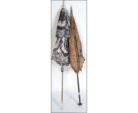 Two vintage 1920's Edwardian ladies parasol umbrellas one having black roses on a white ground, the other having a stunning D