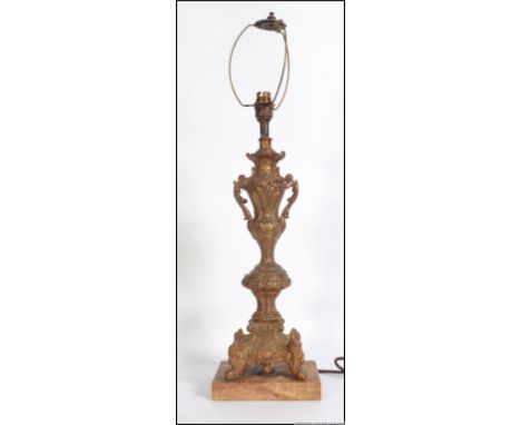 A decorative vintage rococo style Victorian brass table lamp base. Measures 64cm high.