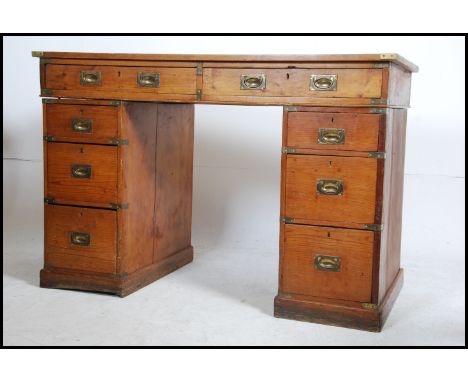 A 1st World War pine twin pedestal campaign desk. The desk with pedestals of drawers having inset drawers to the  desk top. B