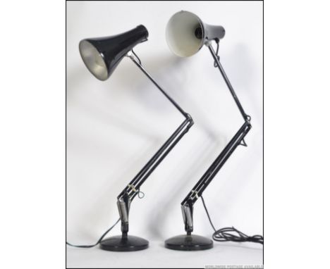 A pair of retro / vintage 20th century Herbert Terry Anglepoise desk lamps. Both in black on circular bases with pendant shad