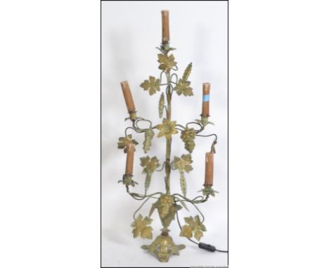 A early to mid 20th century French brass five point candelabra style electric  grape and vine decorated table lamp. Measures 