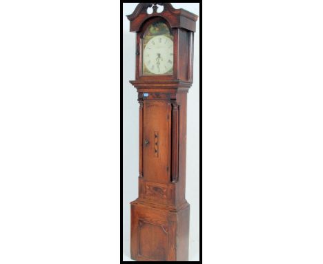 A 19th Century inlaid country oak welsh longcase clock by J Foster of Aberystwyth. The arch shaped hood with glazed door havi