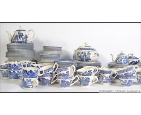 An extensive collection of blue and white china to include dinner and tea services. Various makers, all in the willow pattern