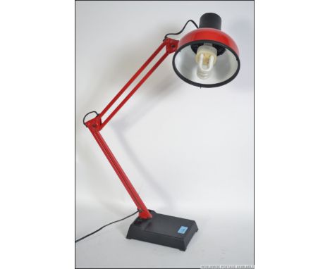 A late 20th century retro anglepoise two tone desk lamp in black and red having squared base with pendant shade. Measures 70c