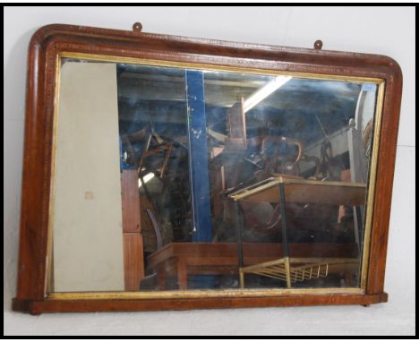 A 19th century large walnut and marquetry tunbridge inlaid overmantel mirror with ceramic bun feet. Measures: 103cms wide x 7