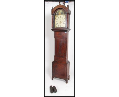 A 19th Century inlaid mahogany longcase clock.  The arch shaped hood with glazed door having painted face with classical scen