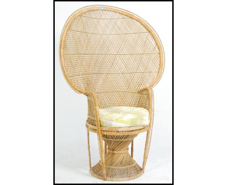 A vintage late 1970's retro wicker peacock armchair -chair. Large open back chair with woven seat.