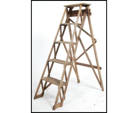 An early 20th century wooden trellis - lattice worked Industrial step ladder. Ideal as conversion to bookcase shelf. Measures