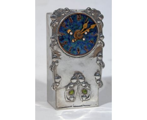 A Tudric pewter clock designed by Archibald Knox for Liberty & Co, having enamel dial, gilt brass hands and numerals, Art Nou