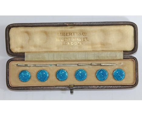 A Liberty & Co cased blue enamel and white metal button set. CONDITION REPORT - hair lines to enamel otherwise ok.