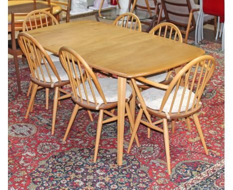 An Ercol blonde elm and beech extending dining table and six chairs (no leaf), min. table dimensions; length 154cm, depth 90c