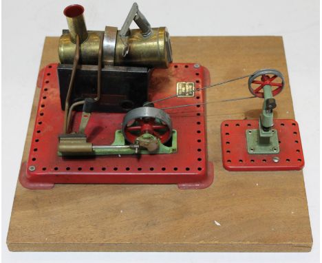 A Mamod stationary steam engine on stand.