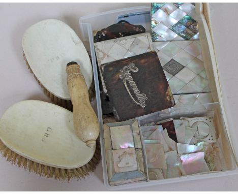 A box of tortoiseshell, mother of pearl and ivory, all spares and repairs.