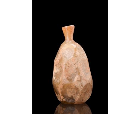Early Islamic, ca. 9th-10th century AD. A nice example of a wheel-cut glass flask of a pear-shaped body with a small flaring 