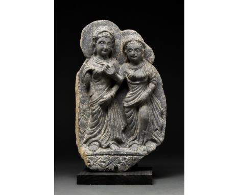 Ca. 300 AD. A schist carving depicting a standing couple, most probably Hariti and Panchika, respectively the Goddess of Fert