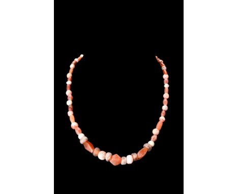 Ca. 100-300 AD. A restrung necklace composed of a stunning array of carnelian beads in various shapes - polygonal, spherical,