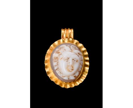 Ca. 100-300 AD. A chalcedony cameo, with its finely carved features and lifelike detail, depicts the infamous Gorgon with her