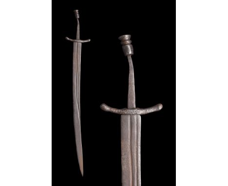 Ca. 1300-1400 AD. An iron falchion with a single-edged, curved blade, with a short back edge, The cross style two guards has 