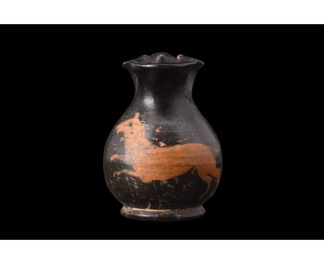 Ca. 350 BC. A black glaze oinochoe with glossy black glaze, serves as the perfect backdrop for the intricate red-figure decor