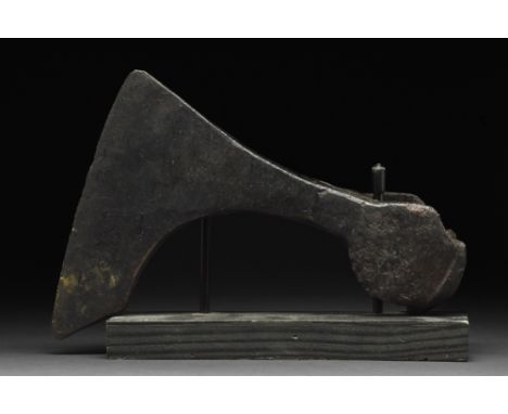 Ca. 900-1100 AD. An iron bearded axe head with an elongated, curved blade and tapering cheek. The bearded axe, or Skeggøx (fr