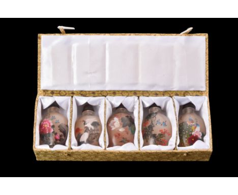 A set of five inside-painted glass snuff bottles is a feast for the senses. Each bottle has been meticulously decorated with 