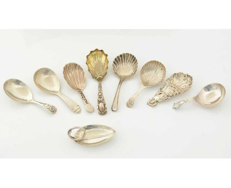 An Elizabeth II silver caddy spoon, a cast reproduction of an earlier spoon (lady in a crinoline dress with parasol) hallmark