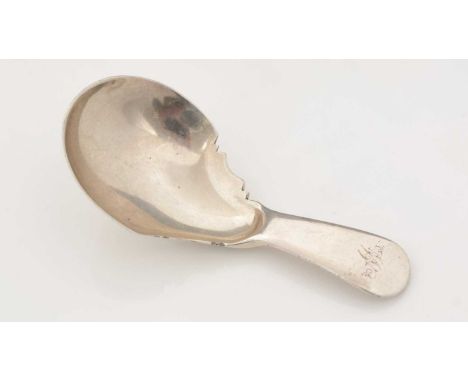 An early 19th Century unascribed silver caddy spoon, initialled "W", with a shaped and waisted bowl, maker's mark "LG" and an