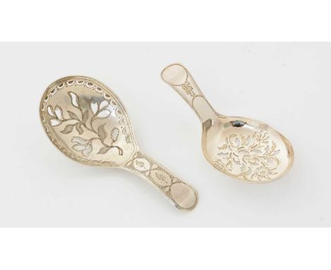 Two George III silver caddy spoons, with pierced bowls and engraved decoration, the larger one by Samuel Pemberton, Birmingha