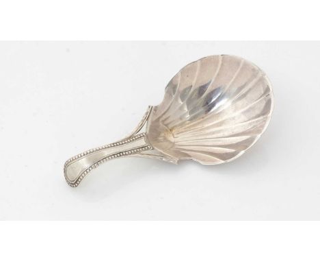 A George III silver caddy spoon, with a bead-pattern stem and a fluted bowl, facetted “flying” buttresses supporting the base