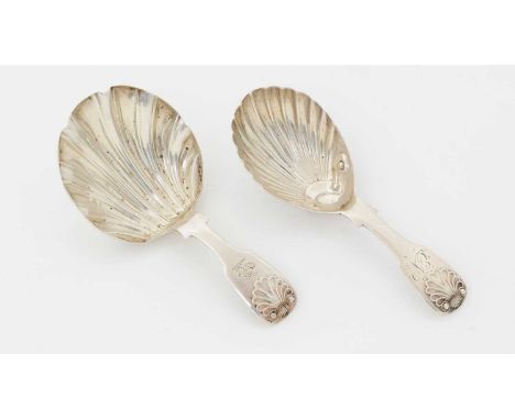 Two Victorian silver provincial caddy spoons, with fiddle and shell pattern stems; one crested and one initialled 'EN', both 