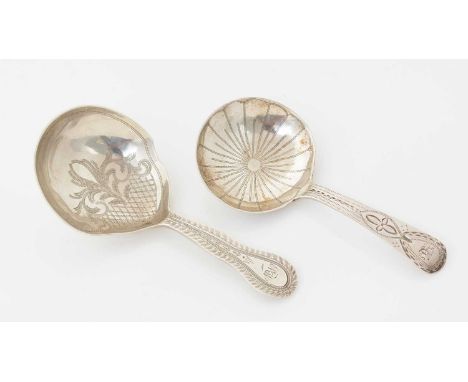 A George III silver provincial caddy spoon, with a bright-cut stem and engraved flowerhead in the bowl, initialled, by Richar