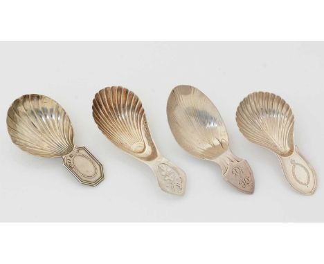 Four various George III silver “stamped” caddy spoons, with lug handles, two with initials by various makers, all Sheffield h