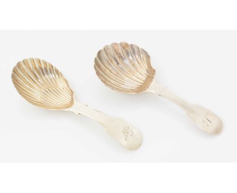 A George III Irish silver caddy spoon, with a fluted bowl and fiddle stem, initialled, by Thomas Townsend, Dublin, 1812; and 